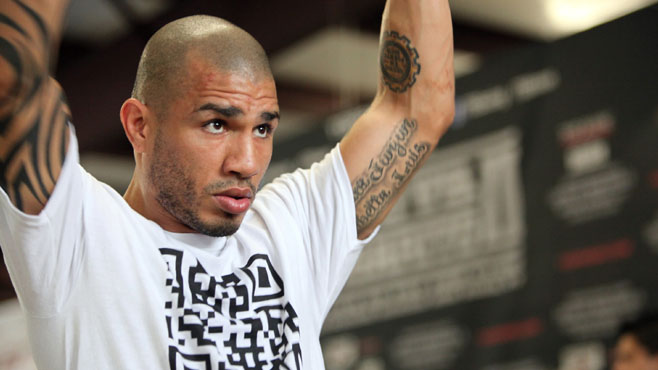 Boxer Cotto from Puerto Rico stares bloodied during fourth round of a WBO World Welterwight Title fight against Clottey from Ghana in New York Boxer Cotto from Puerto Rico